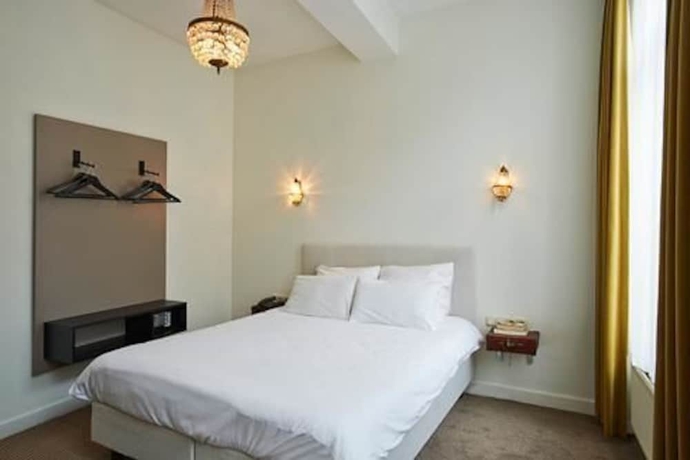 Imagen de la habitación del Hotel Les Charmes. Foto 6
