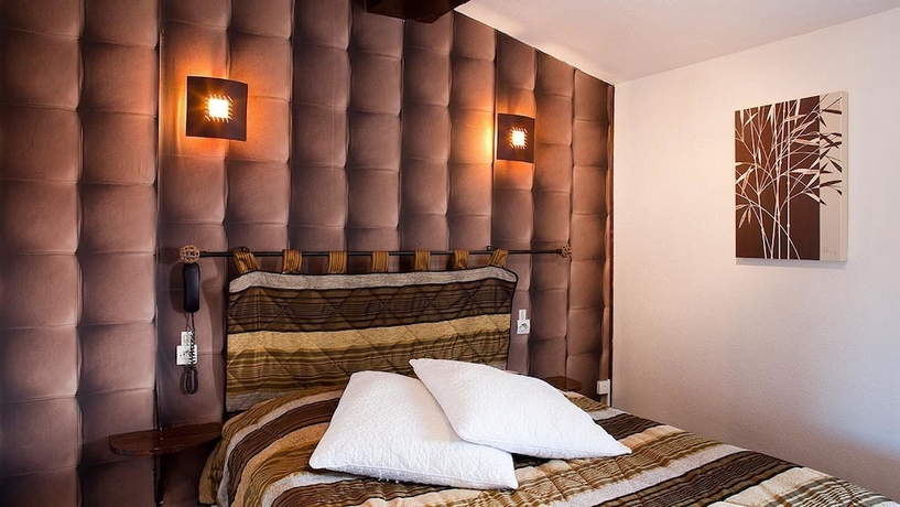 Imagen de la habitación del Hotel Les Clos De Chaponost. Foto 5