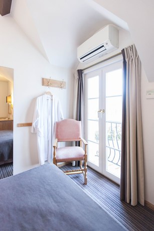 Imagen de la habitación del Hotel Les Eleveurs. Foto 9