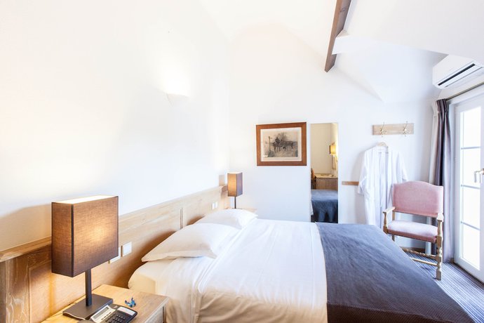 Imagen de la habitación del Hotel Les Eleveurs. Foto 15