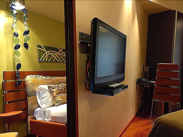 Imagen de la habitación del Hotel Les Fleurs Boutique. Foto 14