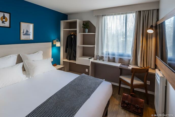 Imagen de la habitación del Hotel Les Hauts de Kerano. Foto 19