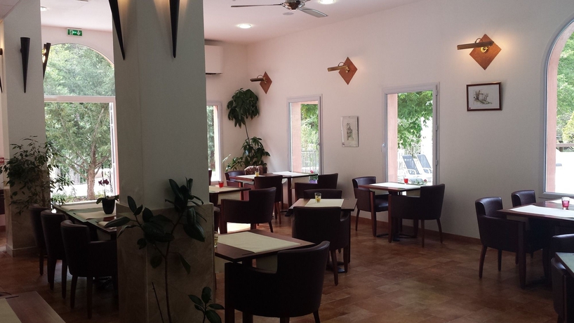 Imagen del bar/restaurante del Hotel Les Jardins De La Glaciere. Foto 3