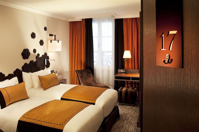 Imagen de la habitación del Hotel Les Jardins De La Villa Hotel. Foto 6