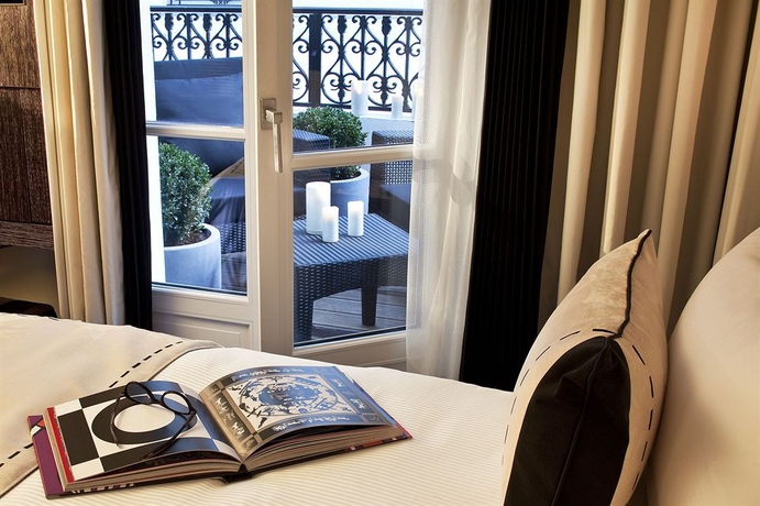 Imagen de la habitación del Hotel Les Jardins De La Villa Hotel. Foto 7