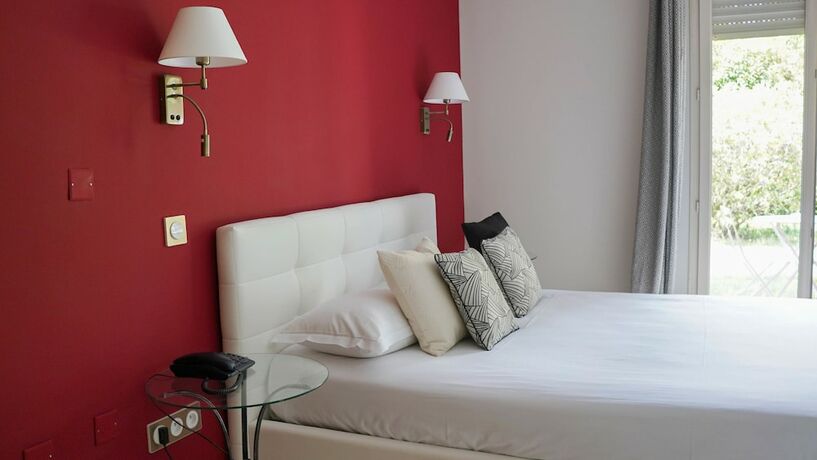 Imagen de la habitación del Hotel Les Jardins. Foto 19