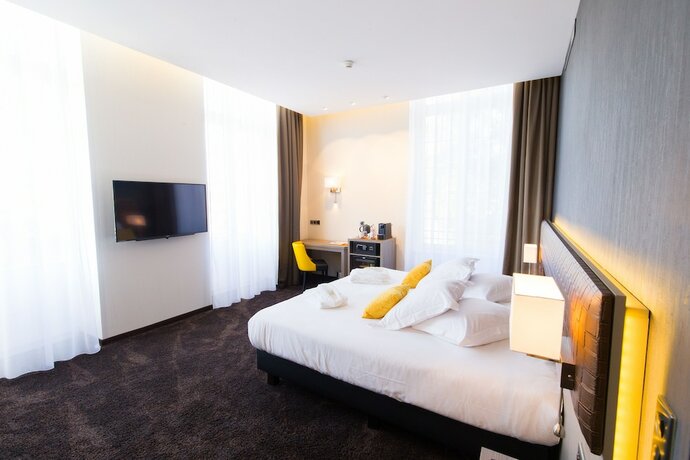 Imagen de la habitación del Hotel Les Jardins du Mess. Foto 14