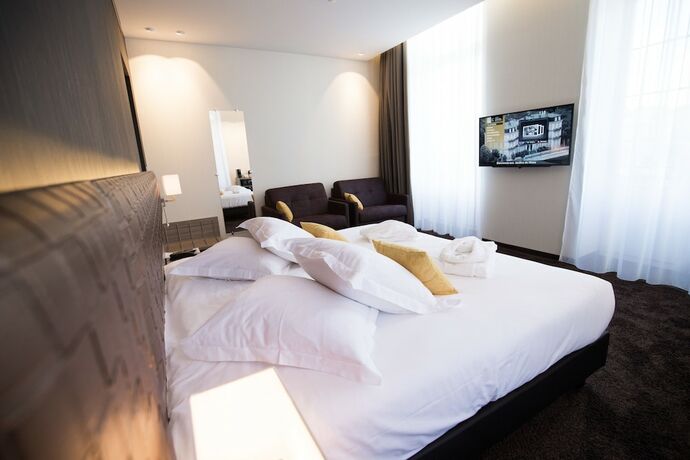 Imagen de la habitación del Hotel Les Jardins du Mess. Foto 16