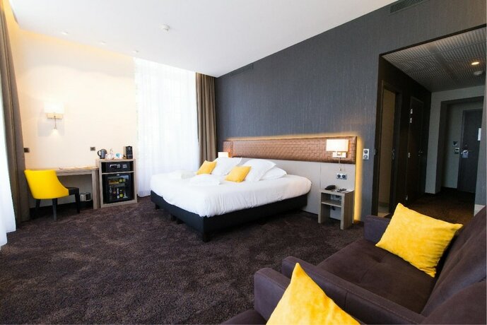 Imagen de la habitación del Hotel Les Jardins du Mess. Foto 17