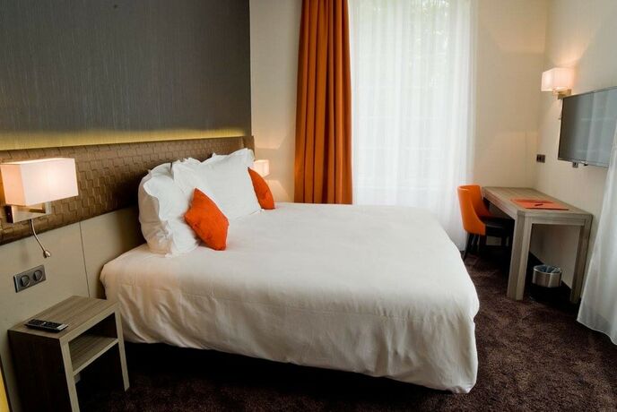 Imagen de la habitación del Hotel Les Jardins du Mess. Foto 18