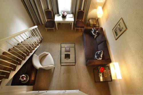 Imagen de la habitación del Hotel Les Manoirs De Tourgéville. Foto 3