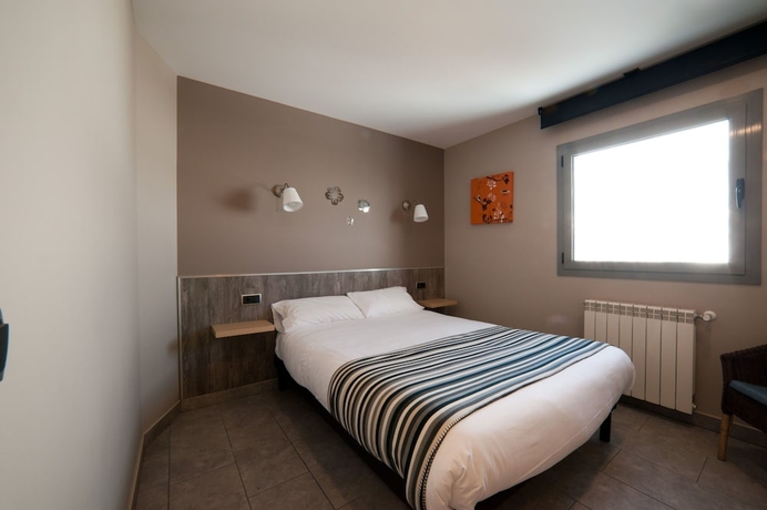 Imagen de la habitación del Hotel Les Olimpiades. Foto 10