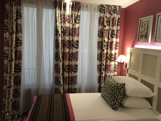 Imagen de la habitación del Hotel Les Tournelles. Foto 14