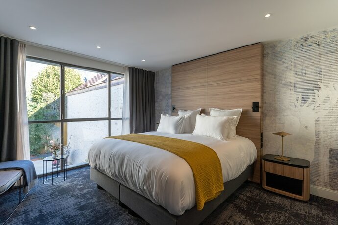 Imagen de la habitación del Hotel Les Tr&eacute;sori&egrave;res. Foto 16
