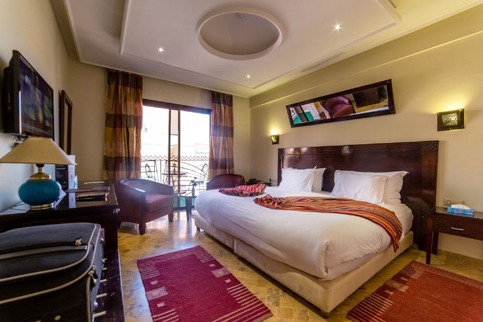 Imagen de la habitación del Hotel Les Trois Palmiers. Foto 2