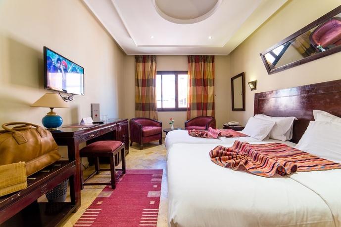 Imagen de la habitación del Hotel Les Trois Palmiers. Foto 4