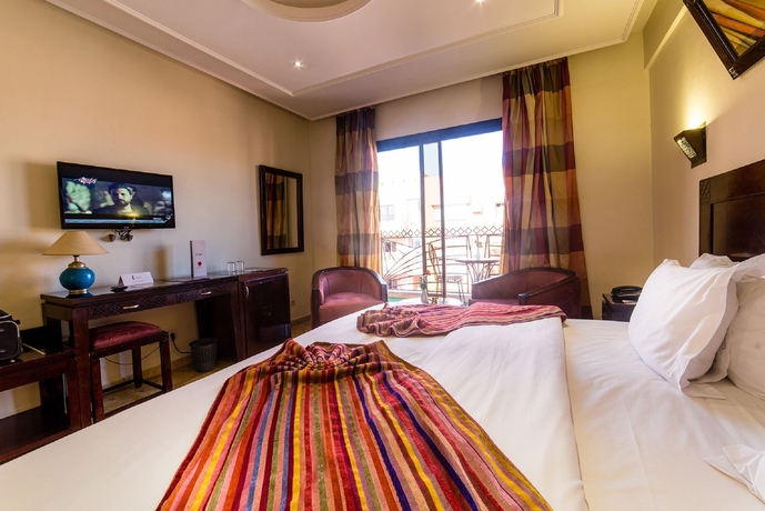 Imagen de la habitación del Hotel Les Trois Palmiers. Foto 10