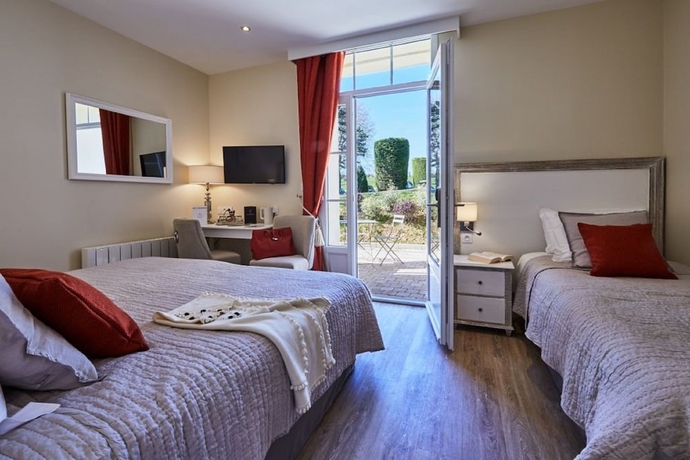 Imagen de la habitación del Hotel Les Villas D'arromanches. Foto 17