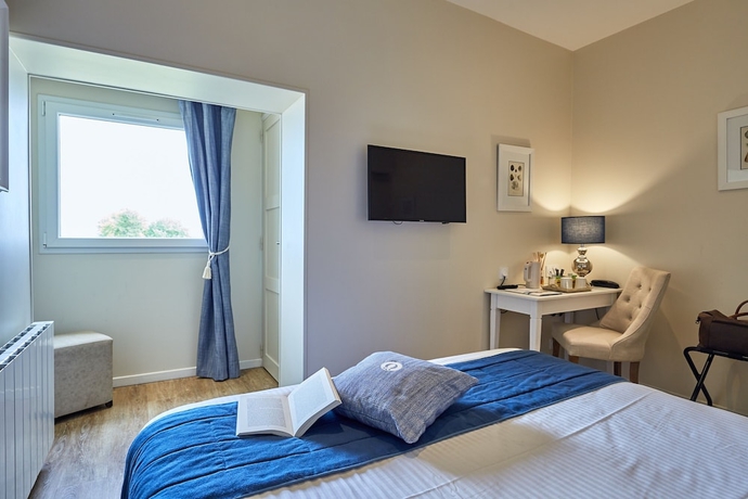Imagen de la habitación del Hotel Les Villas D'arromanches. Foto 18
