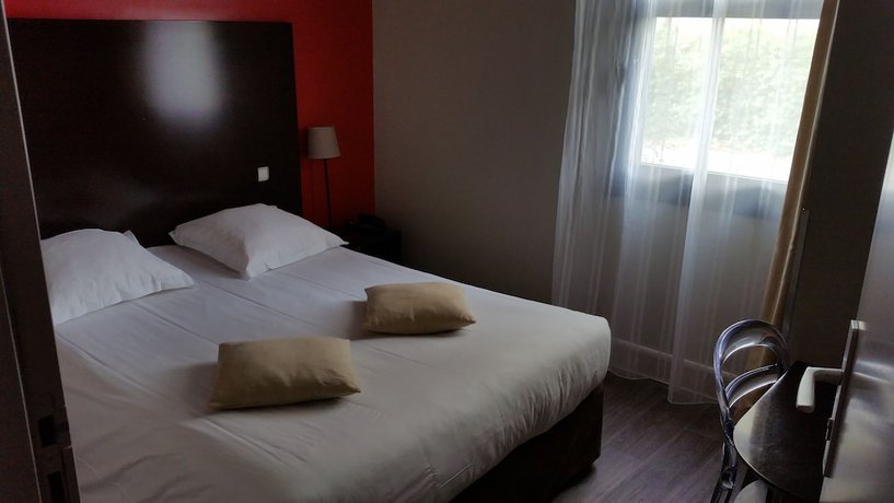 Imagen de la habitación del Hotel Les jardins du canal. Foto 3