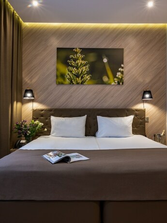 Imagen de la habitación del Hotel Lesnoy Country House, Lesnoy Gorodok. Foto 19