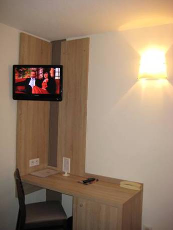 Imagen de la habitación del Hotel L'h&ocirc;tel Des Trois Massifs. Foto 8