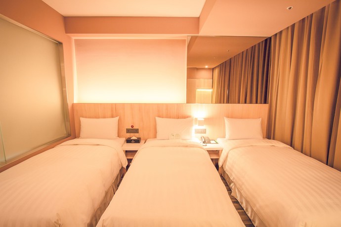 Imagen de la habitación del Hotel Li Duo Best. Foto 7
