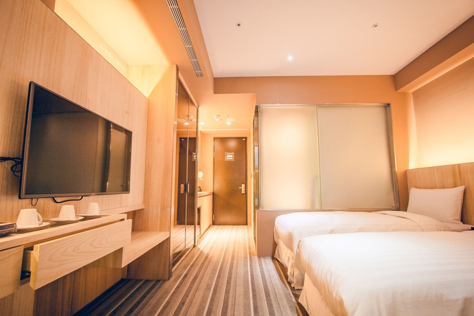 Imagen de la habitación del Hotel Li Duo Best. Foto 8