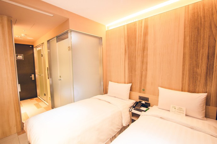 Imagen de la habitación del Hotel Li Duo Best. Foto 9