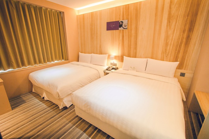 Imagen de la habitación del Hotel Li Duo Best. Foto 11