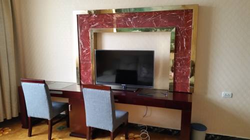 Imagen de la habitación del Hotel Li Ping. Foto 7