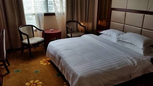 Imagen de la habitación del Hotel Li Ping. Foto 8