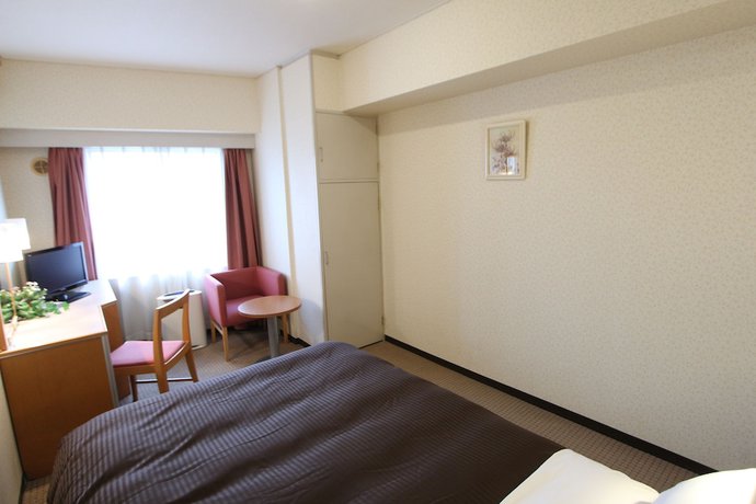 Imagen de la habitación del Hotel LiVEMAX BUDGET Yokohama Kannai. Foto 11
