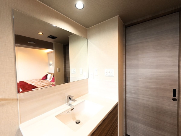 Imagen de la habitación del Hotel LiVEMAX RESORT ATAMI SEA FRONT. Foto 15
