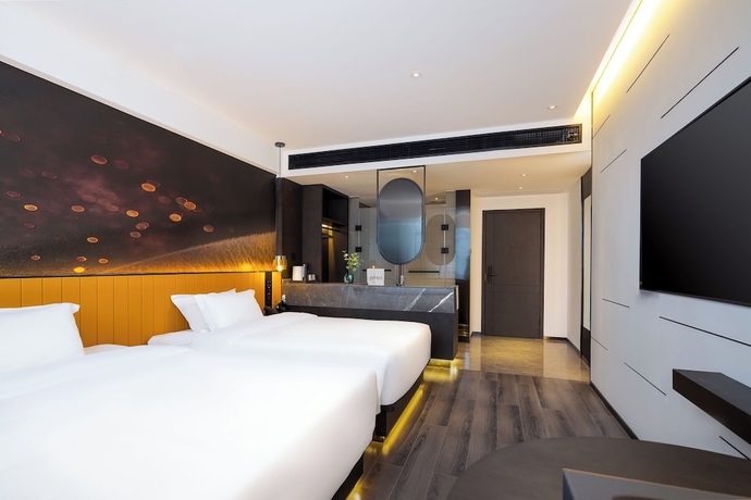 Imagen de la habitación del Hotel LiangZhi Huipin, HAIKOU. Foto 5