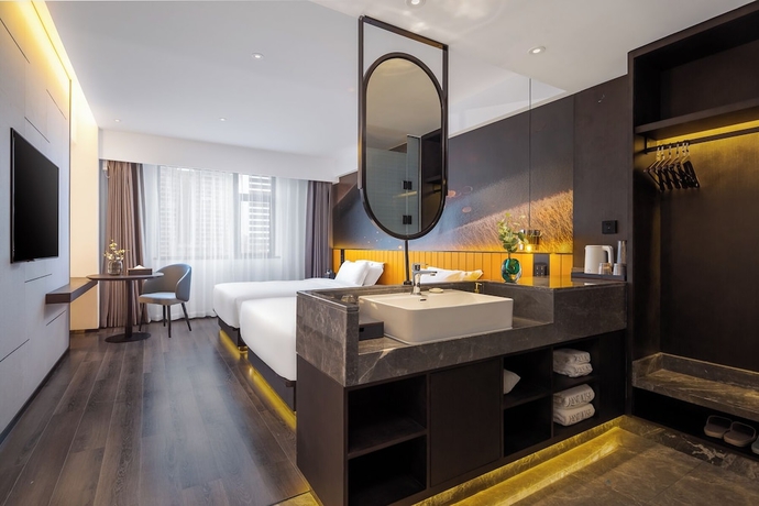 Imagen de la habitación del Hotel LiangZhi Huipin, HAIKOU. Foto 10
