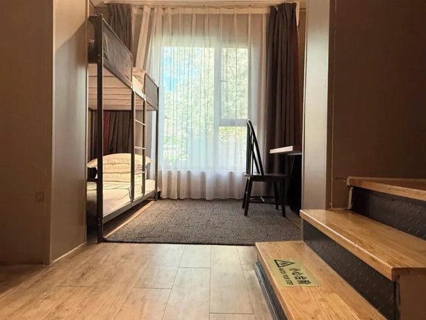 Imagen de la habitación del Hotel Liangzhu Guesthouse. Foto 14