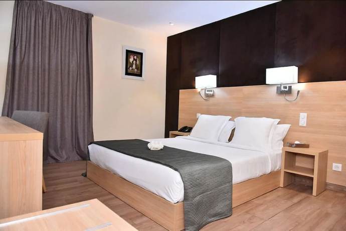 Imagen de la habitación del Hotel Liberte Express. Foto 2