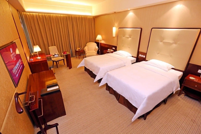 Imagen de la habitación del Hotel Lihua Grand. Foto 2