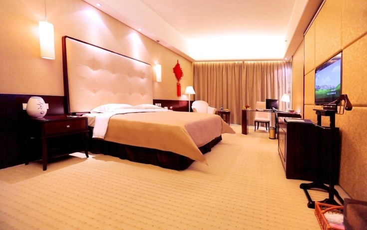 Imagen de la habitación del Hotel Lihua Grand. Foto 14