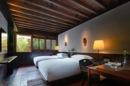 Imagen de la habitación del Hotel Lijiang Ancient City Anyu. Foto 19