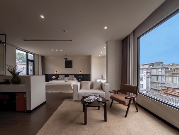 Imagen de la habitación del Hotel Lijiang Ancient City Hitone Resort. Foto 4