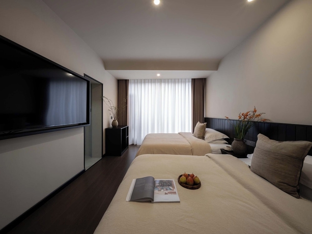 Imagen de la habitación del Hotel Lijiang Ancient City Hitone Resort. Foto 6