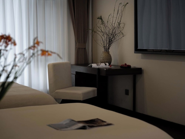 Imagen de la habitación del Hotel Lijiang Ancient City Hitone Resort. Foto 9