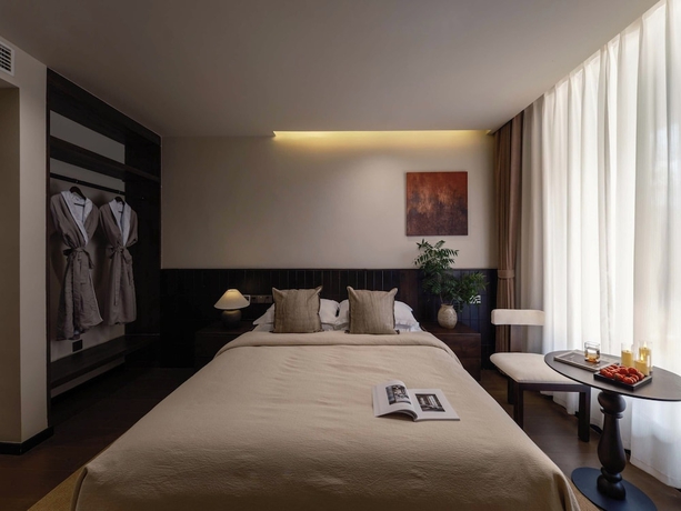 Imagen de la habitación del Hotel Lijiang Ancient City Hitone Resort. Foto 11