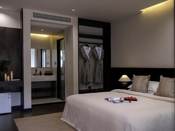 Imagen de la habitación del Hotel Lijiang Ancient City Hitone Resort. Foto 13
