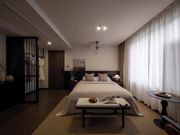 Imagen de la habitación del Hotel Lijiang Ancient City Hitone Resort. Foto 15