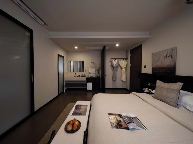 Imagen de la habitación del Hotel Lijiang Ancient City Hitone Resort. Foto 16