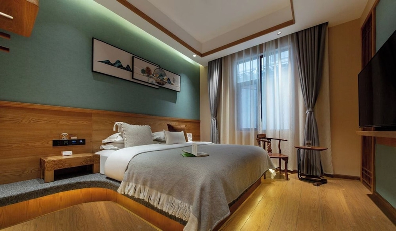 Imagen de la habitación del Hotel Lijiang Ancient Town Nanzhuang Inn. Foto 11