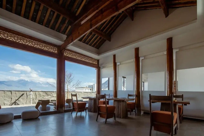 Imagen del bar/restaurante del Hotel Lijiang Ancient Town Nanzhuang Inn. Foto 4